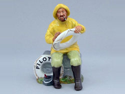 Boatman A HN2417 - Designer: Mary Nicoll, Issued: 1971-1987. A limited edition figurine produced for an anniversary of Pilot Insurance Company.